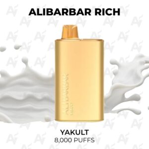Gold rectangular bottle labeled ALIBARBAR RICH against a milk-splash background, text shows 'YAKULT 8,000 PUFFS'