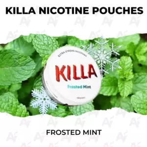 Close-up of a KILLA nicotine pouches Frosted Mint tin among fresh mint leaves, with bold KILLA branding visible.