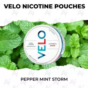 Tin of Velo nicotine pouches Peppermint Storm displayed on fresh mint leaves