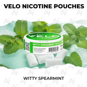 VELO nicotine pouches tin labeled Witty Spearmint with fresh mint leaves around it, product shot for the flavor